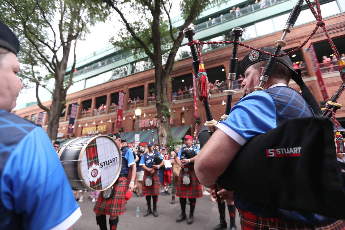 BOSTON, MASSACHUSETTS - JUNE 14: Members of Scotland's "Tartan Army" play outside of Fenway Park before a game between the Texas Rangers and the Boston Red Soxon June 14, 2026 in Boston, Massachusetts. (Photo by Paul Rutherford/Getty Images)